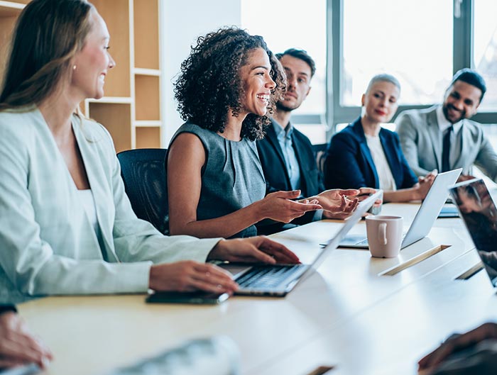 About—Image-of-employees-in-meeting-